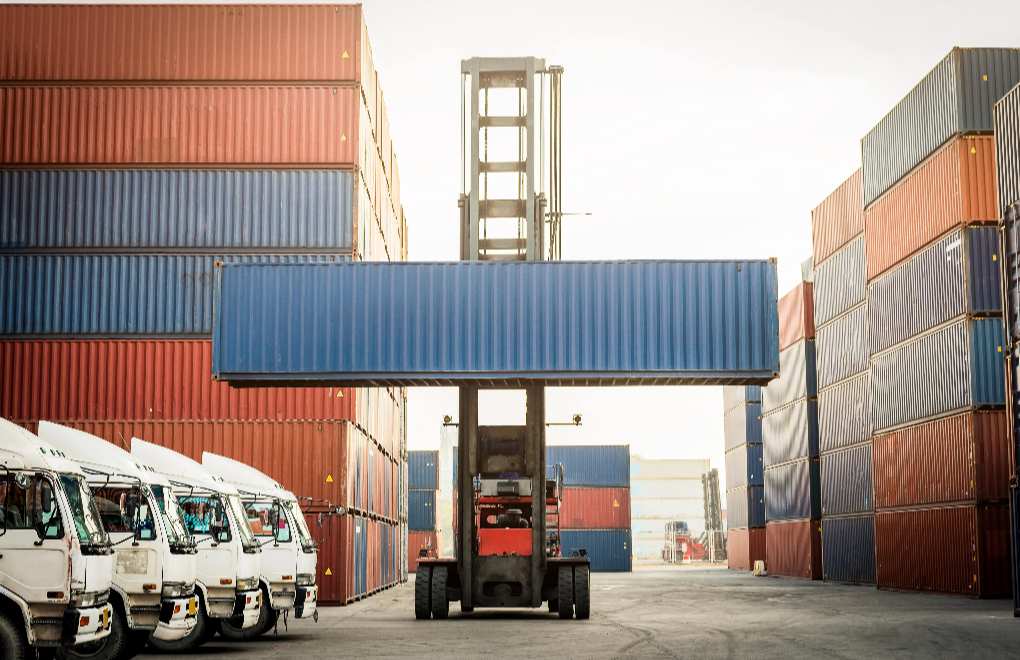 line of cargo truck and forklift with container box for export import shipping at yard