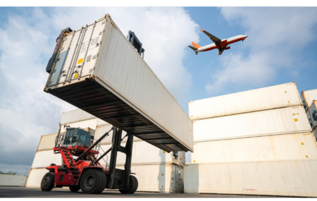 cargo container for overseas shipping in shipyard with airplane in the sky